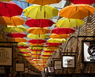 LONDON, UK - MAY 27, 2023:  Colourful umbrellas in the Stables Market at Camden
