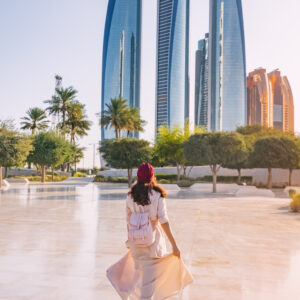 Revel in the beauty of Abu Dhabi's breathtaking architecture and multicultural vibrancy, embodied by the elegant figure of an Indian woman.